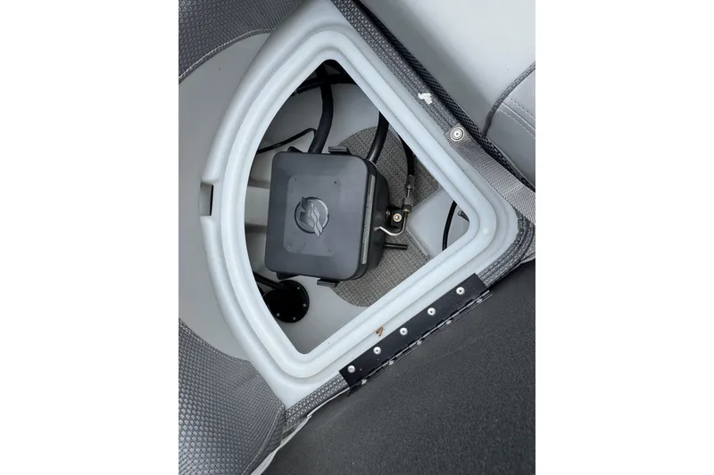 Slide: The Image of Storage compartment of 2024 Regency 230 DL3 boat, featuring a secure latch system. - 25