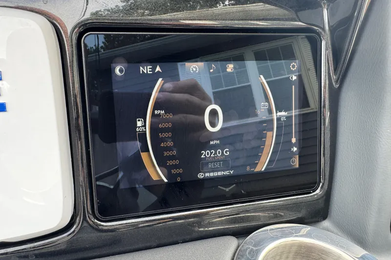 Slide: The Image of Dashboard display of 2024 Regency 230 DL3 showing RPM, speed, and fuel data. - 35