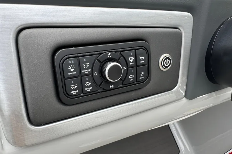 Slide: The Image of Control panel of 2024 Regency 230 DL3 boat with various function buttons. - 37