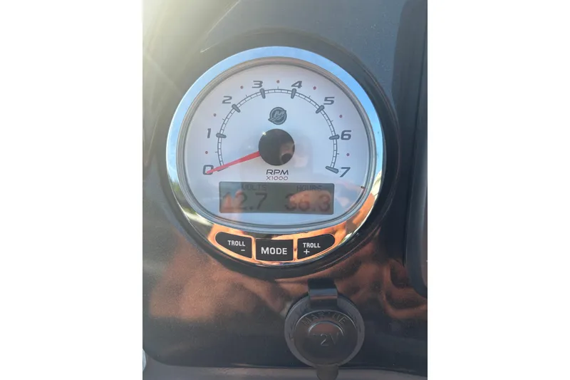 Slide: The Image of Close-up of a 2021 Regency 250 DL3 tachometer displaying RPM and voltage readings. - 9
