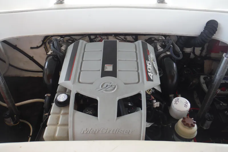 Slide: The Image of 2001 Powerquest 280 Silencer engine compartment featuring a MerCruiser 496 MAG engine. - 10