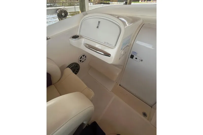 Slide: The Image of Interior of 2001 Powerquest 280 Silencer boat, featuring seating and storage compartments. - 13