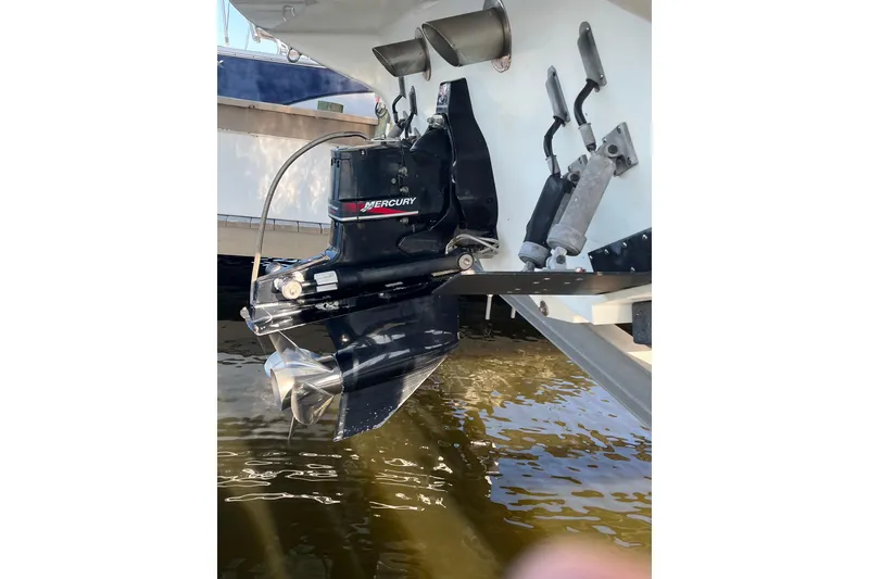 Slide: The Image of 2001 Powerquest 280 Silencer boat with Mercury outboard motor in water. - 27