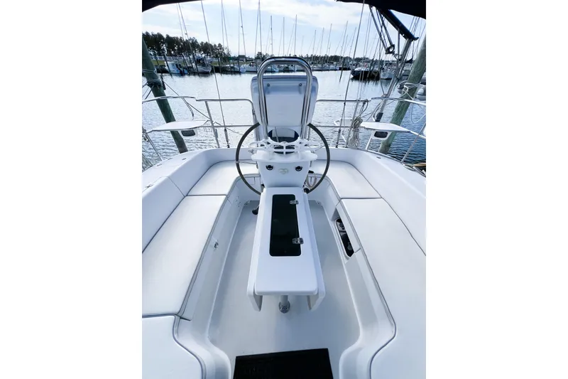 Slide: The Image of Cockpit of a 2005 Catalina 350 sailboat with steering wheel and seating. - 10