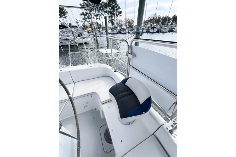Slide: The Image of Cockpit view of 2005 Catalina 350 sailboat with marina background. - 13