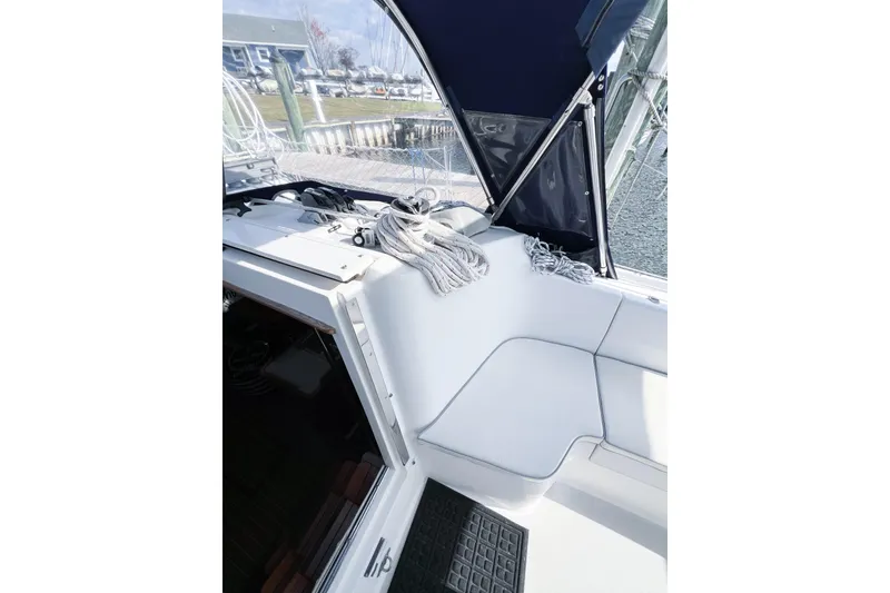Slide: The Image of Cockpit of 2005 Catalina 350 sailboat with ropes and seating area. - 15