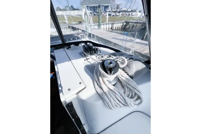 Slide: The Image of Deck view of a 2005 Catalina 350 sailboat with coiled ropes and winch. - 16
