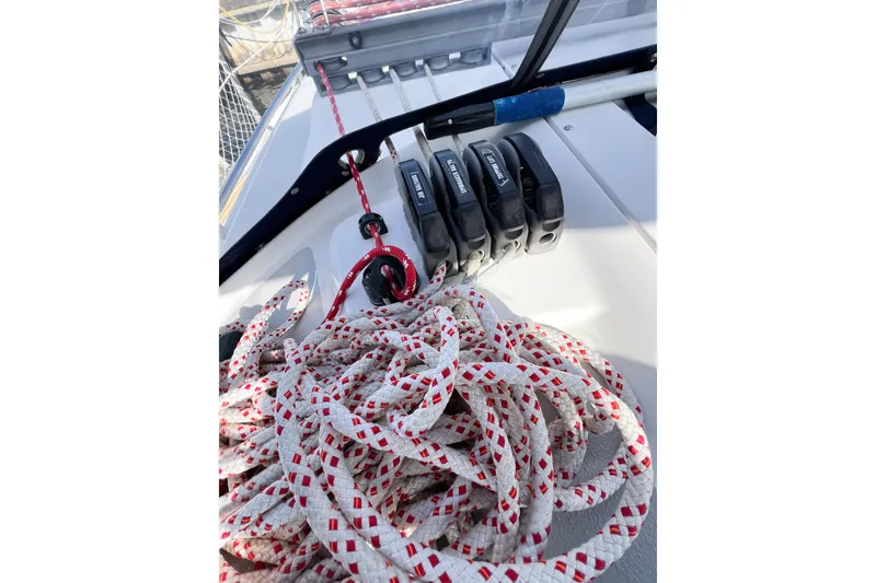 Slide: The Image of Rope and cleats on a 2005 Catalina 350 sailboat deck. - 17