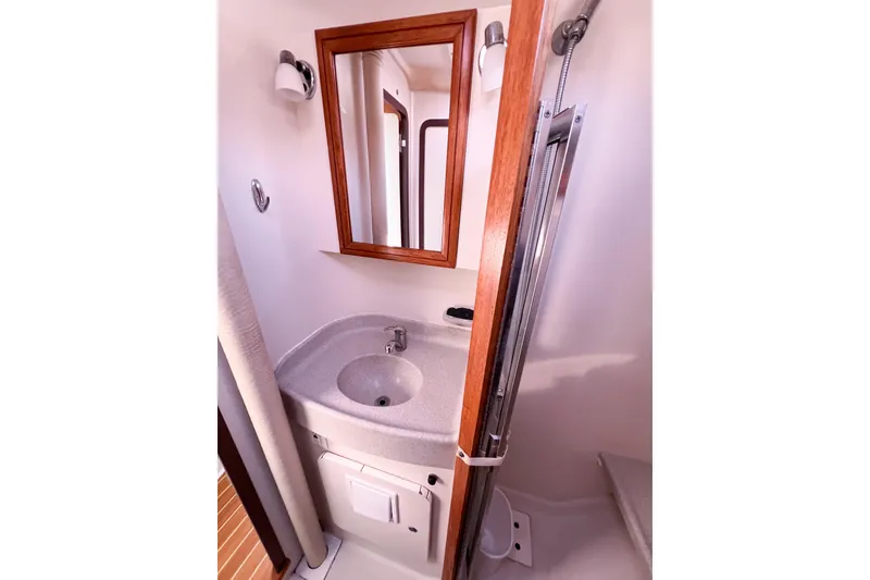 Slide: The Image of Bathroom interior of 2005 Catalina 350 yacht with sink and mirror. - 38