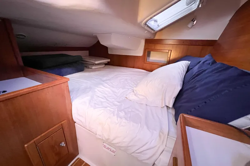 Slide: The Image of Cozy cabin interior of 2005 Catalina 350 sailboat with comfortable bedding. - 48