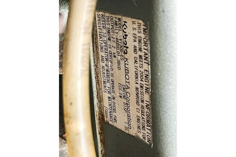 Slide: The Image of Engine information label on a 2005 Catalina 350, featuring Kubota specifications. - 61