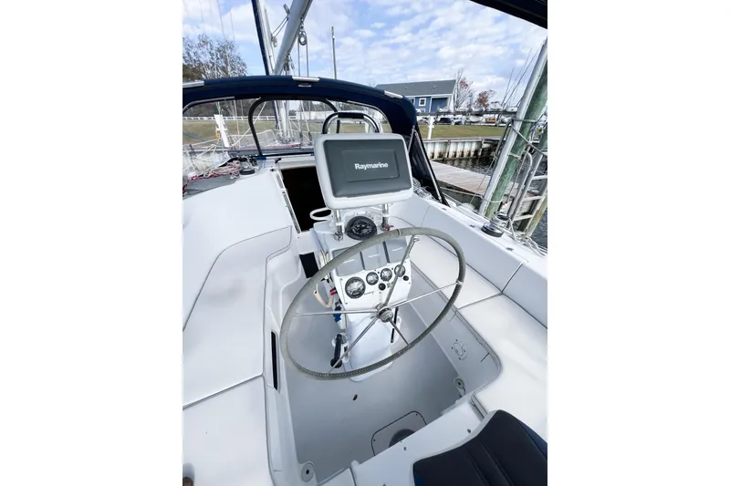 Slide: The Image of Cockpit of 2005 Catalina 350 sailboat with steering wheel and navigation equipment. - 9