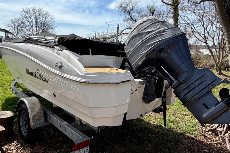 Slide: The Image of 2022 NauticStar 203 DC boat on trailer with Yamaha outboard motor. - 6