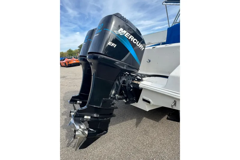 Slide: The Image of Twin Mercury outboard engines on a 2001 Fountain 31 Tournament Edition boat. - 13