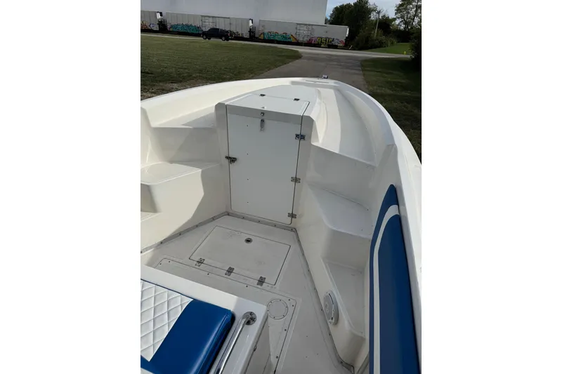 Slide: The Image of 2001 Fountain 31 Tournament Edition boat interior with seating and storage compartments. - 21