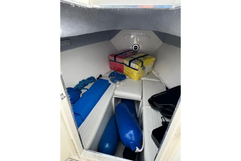 Slide: The Image of Interior cabin of 2001 Fountain 31 Tournament Edition boat with storage items. - 28