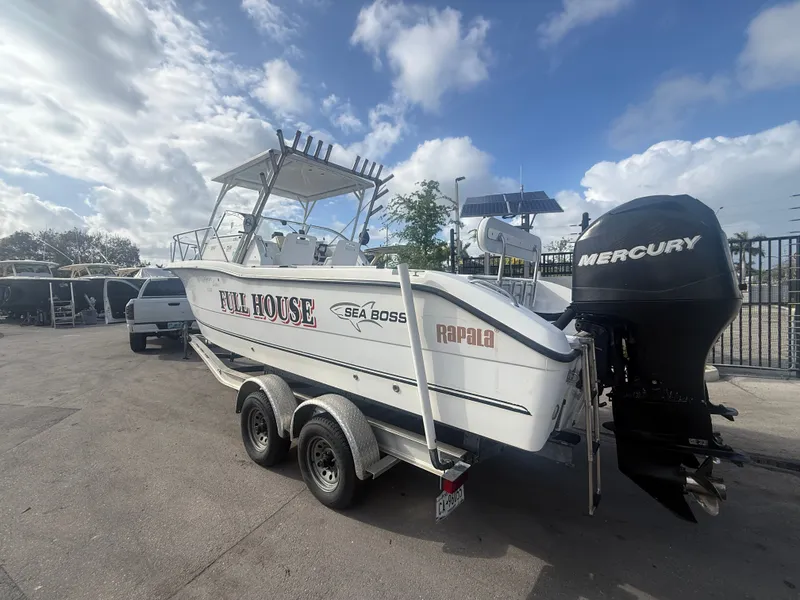 The Image of 2007 Sea Boss 255 WA boat with Mercury engine on trailer. - 0