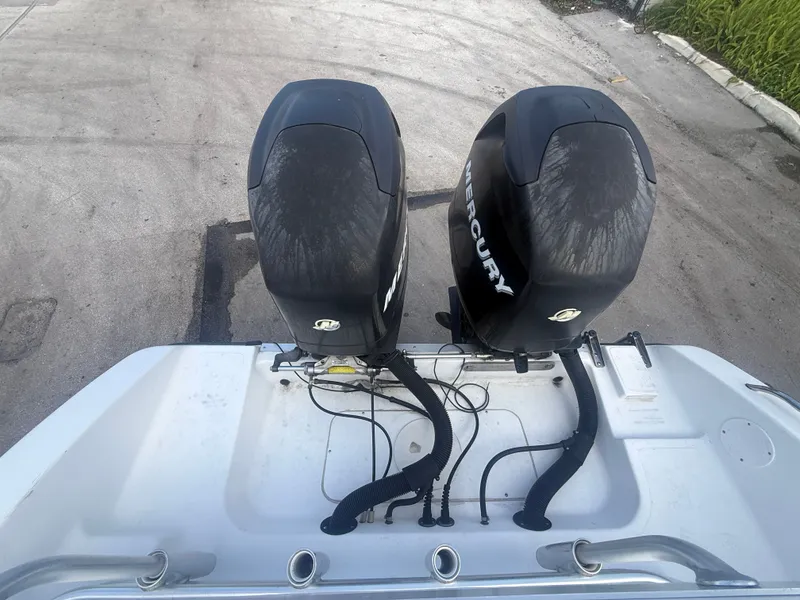 Slide: The Image of Rear view of a 2007 Sea Boss 255 WA with Mercury engines. - 5