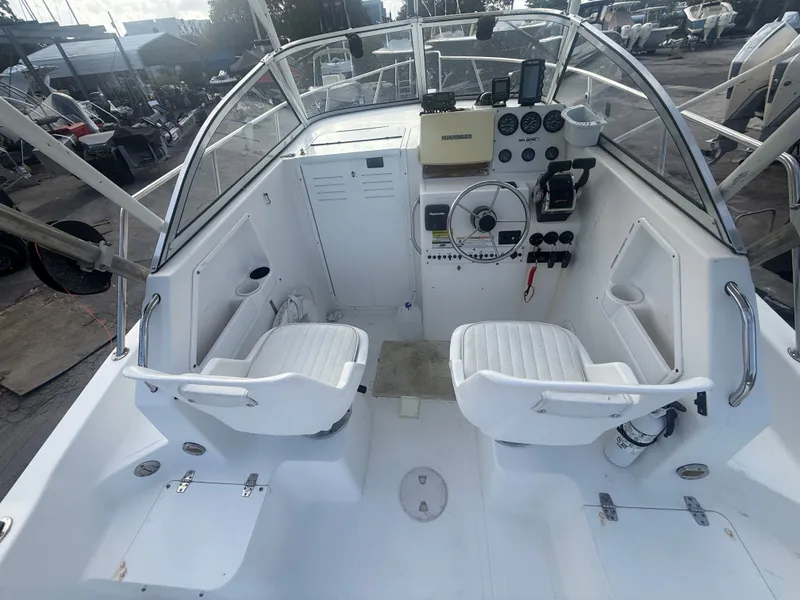 Slide: The Image of Interior of a 2007 Sea Boss 255 WA boat with helm console. - 7