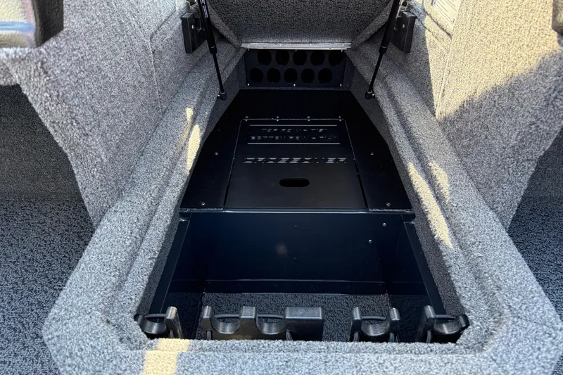 Slide: The Image of Interior storage compartment of 2026 Lund 1875 Crossover XS boat, featuring organized layout. - 22