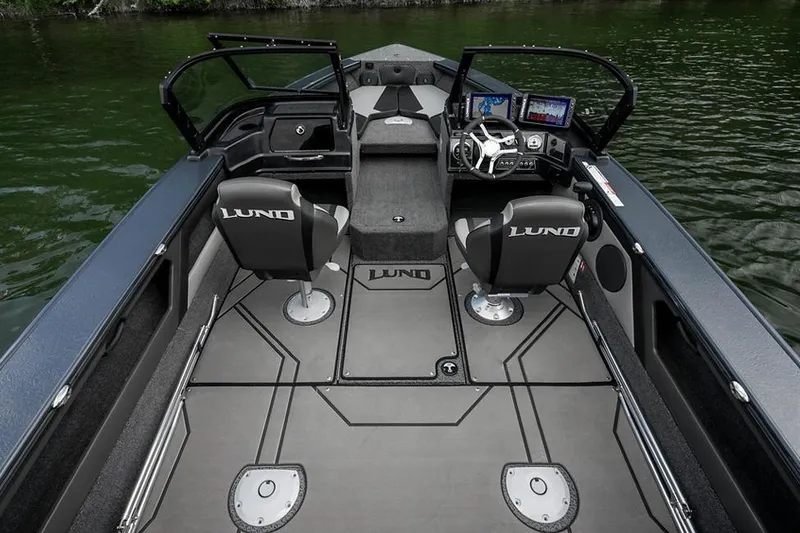 Slide: The Image of Manufacturer Provided Image: 2026 Lund 1875 Crossover XS boat interior with dual seats and modern dashboard. - 6