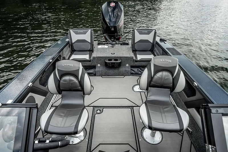 Slide: The Image of Manufacturer Provided Image: 2026 Lund 1875 Crossover XS boat interior with sleek seating and modern design on water. - 8
