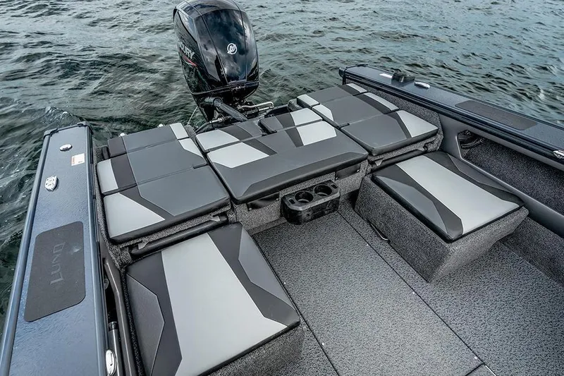 Slide: The Image of Manufacturer Provided Image: 2026 Lund 1875 Crossover XS boat interior with cushioned seating and Mercury outboard motor. - 9