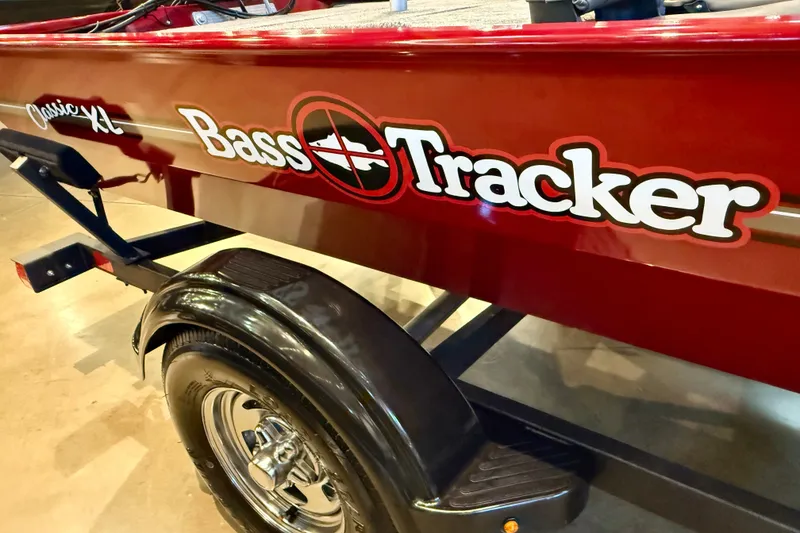Slide: The Image of 2026 Tracker Bass Tracker Classic XL boat with red exterior and logo. - 16