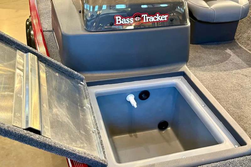 Slide: The Image of Open storage compartment in 2026 Tracker Bass Tracker Classic XL boat interior. - 13