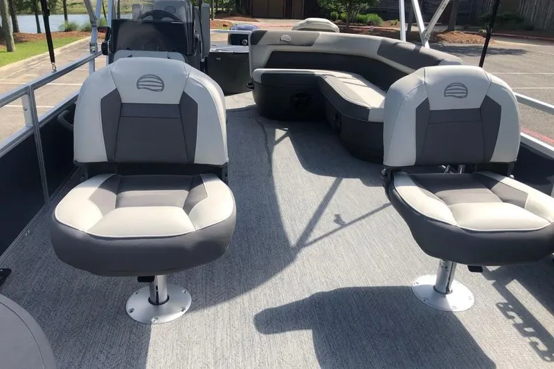 Slide: The Image of 2026 Sun Tracker Bass Buggy 18 DLX pontoon boat interior with comfortable seating. - 3