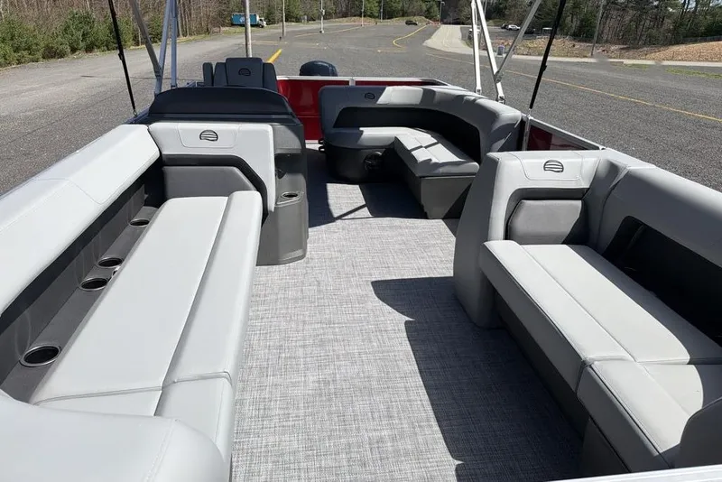 Slide: The Image of 2026 Sun Tracker Party Barge 18 DLX interior with spacious seating and cup holders. - 9