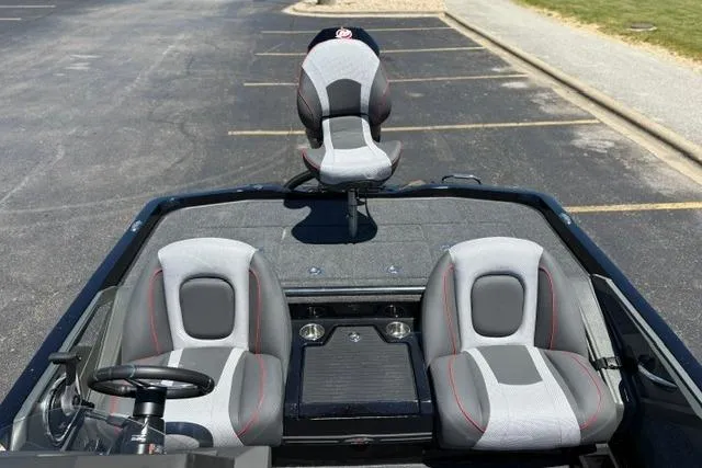 Slide: The Image of 2026 Ranger Z518 Cup-Equipped boat interior with three gray and red seats. - 125