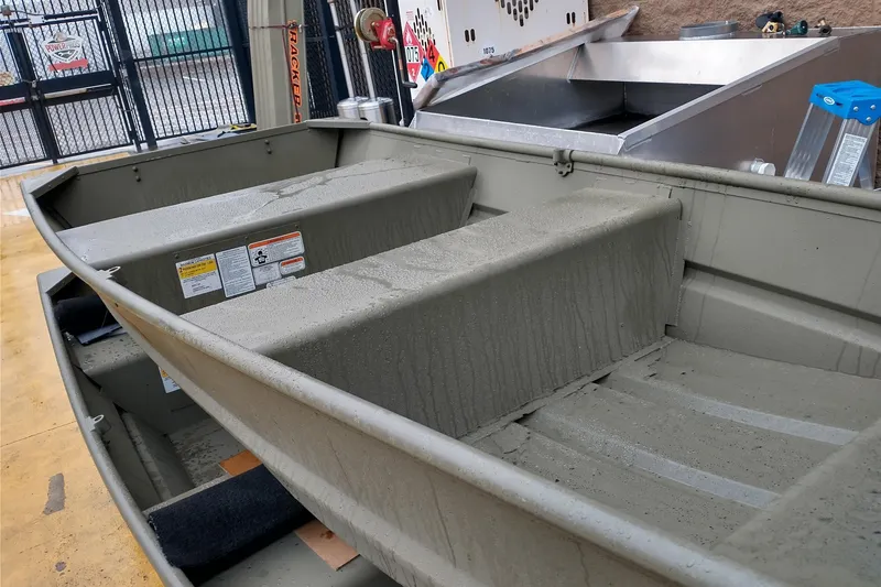 Slide: The Image of 2026 Tracker Grizzly 10 Jon boat interior, showcasing seating and storage areas. - 4