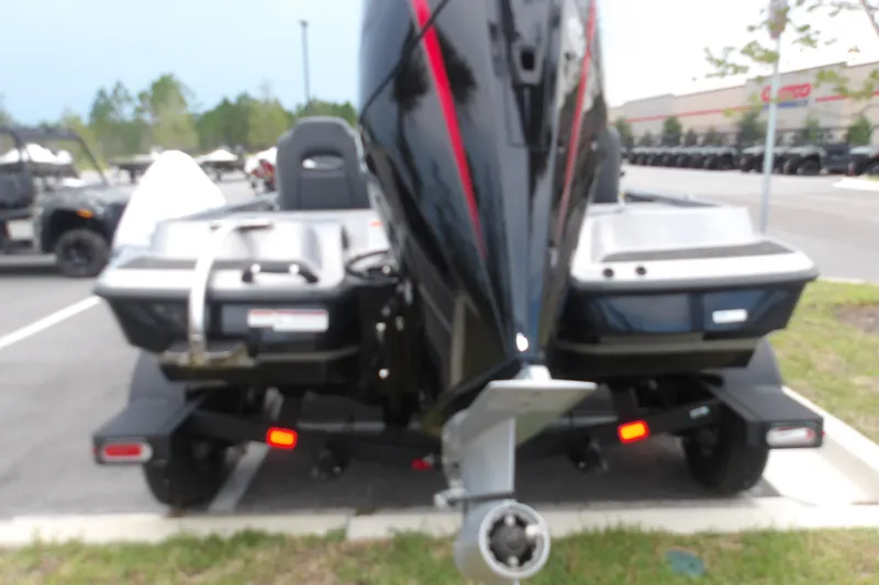 Slide: The Image of 2026 Nitro Z19 XL boat on trailer, rear view in parking lot. - 5