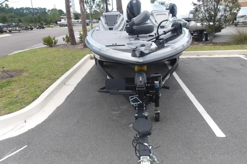 The Image of 2026 Nitro Z19 XL boat parked in a lot, front view. - 1