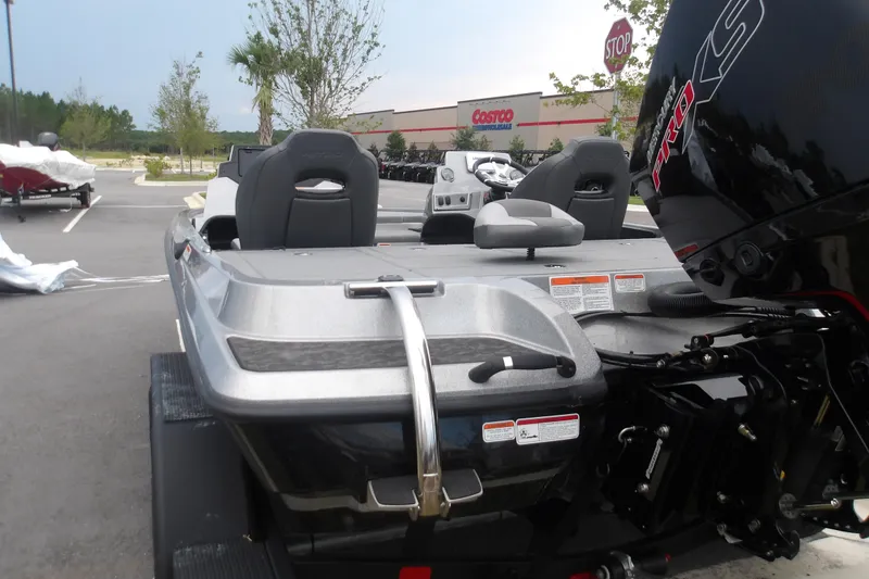Slide: The Image of 2026 Nitro Z19 XL boat parked near Costco, featuring sleek design and powerful engine. - 4