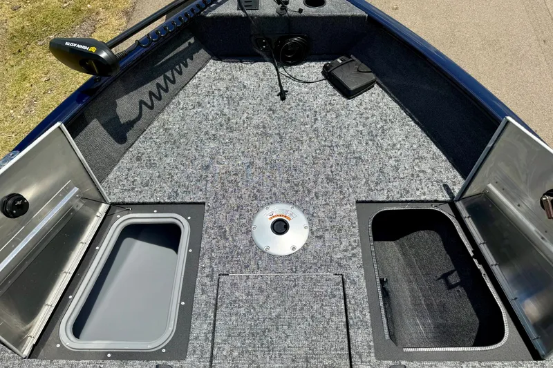 Slide: The Image of 2026 Tracker Pro Guide V-175 WT boat deck with storage compartments and trolling motor. - 17