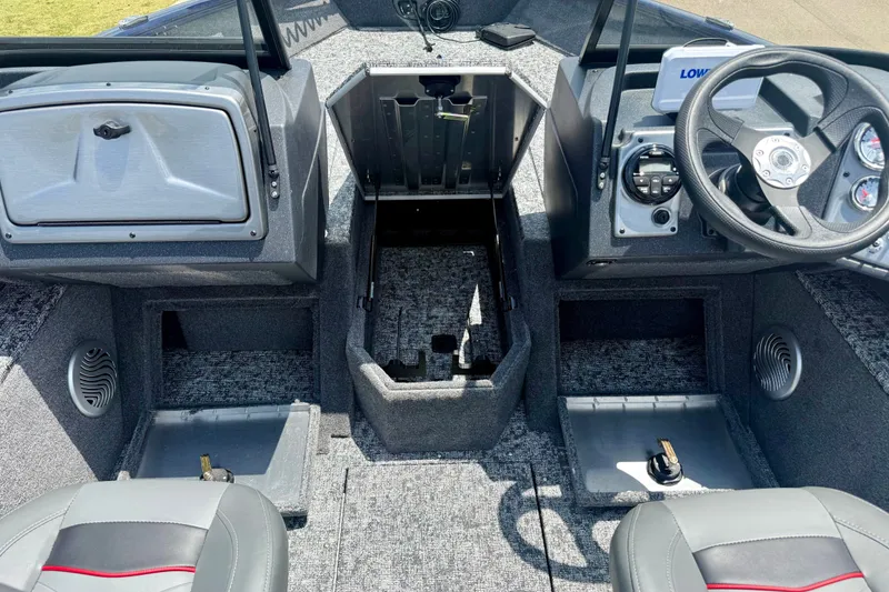 Slide: The Image of 2026 Tracker Pro Guide V-175 WT boat interior with steering wheel and storage compartments. - 15