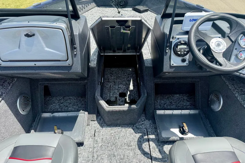 Slide: The Image of 2026 Tracker Pro Guide V-175 WT boat interior with steering wheel and storage compartments. - 16