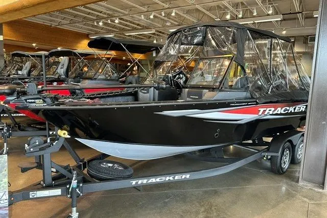 The Image of 2026 Tracker Targa V-19 Combo boat displayed indoors on a trailer. - 0