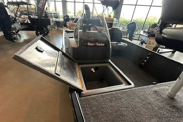 Slide: The Image of 2026 Tracker Bass Tracker Classic XL boat interior with open storage compartment. - 8