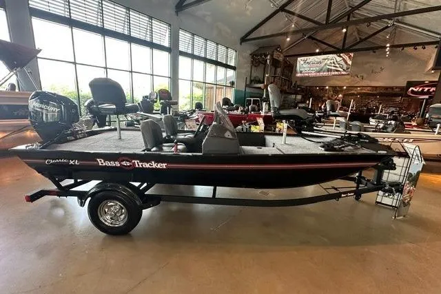 Slide: The Image of 2026 Tracker Bass Tracker Classic XL boat displayed in a showroom. - 4