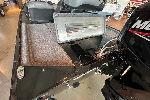 Slide: The Image of 2026 Tracker Bass Tracker Classic XL boat interior with motor and seating. - 11