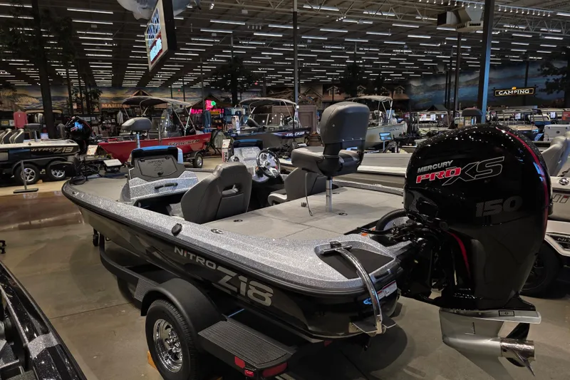 Slide: The Image of 2026 Nitro Z18 Pro boat with Mercury Pro XS engine displayed in showroom. - 2