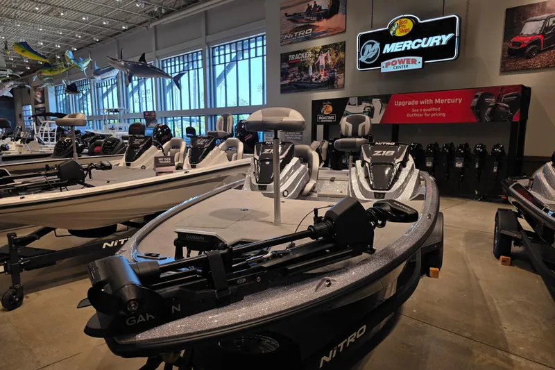 Slide: The Image of 2026 Nitro Z18 Pro boat displayed in showroom with Mercury Power Center signage. - 3