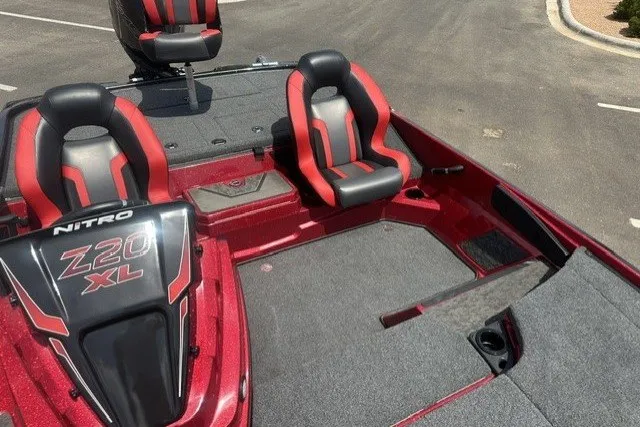 Slide: The Image of 2026 Nitro Z20 XL boat with red and black seating, spacious deck, and sleek design. - 10