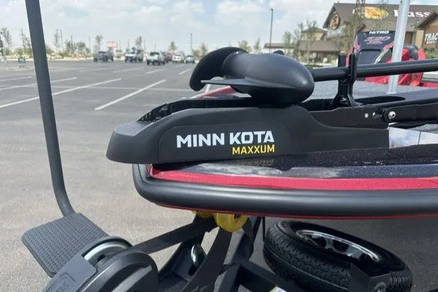 Slide: The Image of Minn Kota Maxxum trolling motor on 2026 Nitro Z20 XL boat in parking lot. - 8