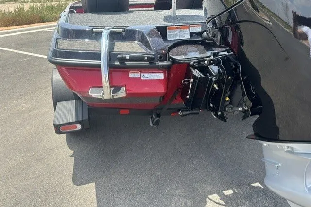 Slide: The Image of 2026 Nitro Z20 XL boat trailer hitch and motor mount in a parking lot. - 2
