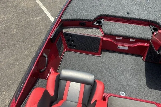 Slide: The Image of 2026 Nitro Z20 XL boat interior with red and gray seating, carpeted deck, and storage compartments. - 13