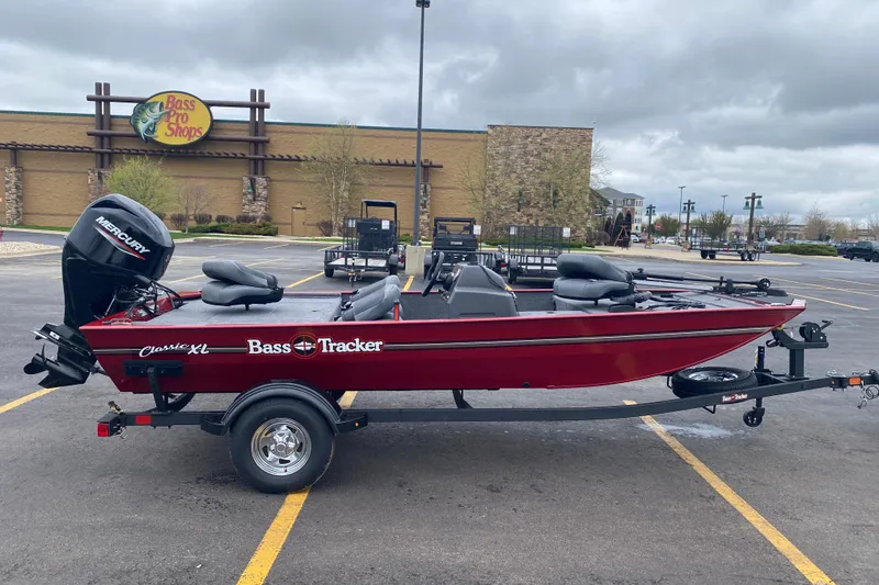 Slide: The Image of 2026 Tracker Bass Tracker Classic XL boat in parking lot near Bass Pro Shops. - 63